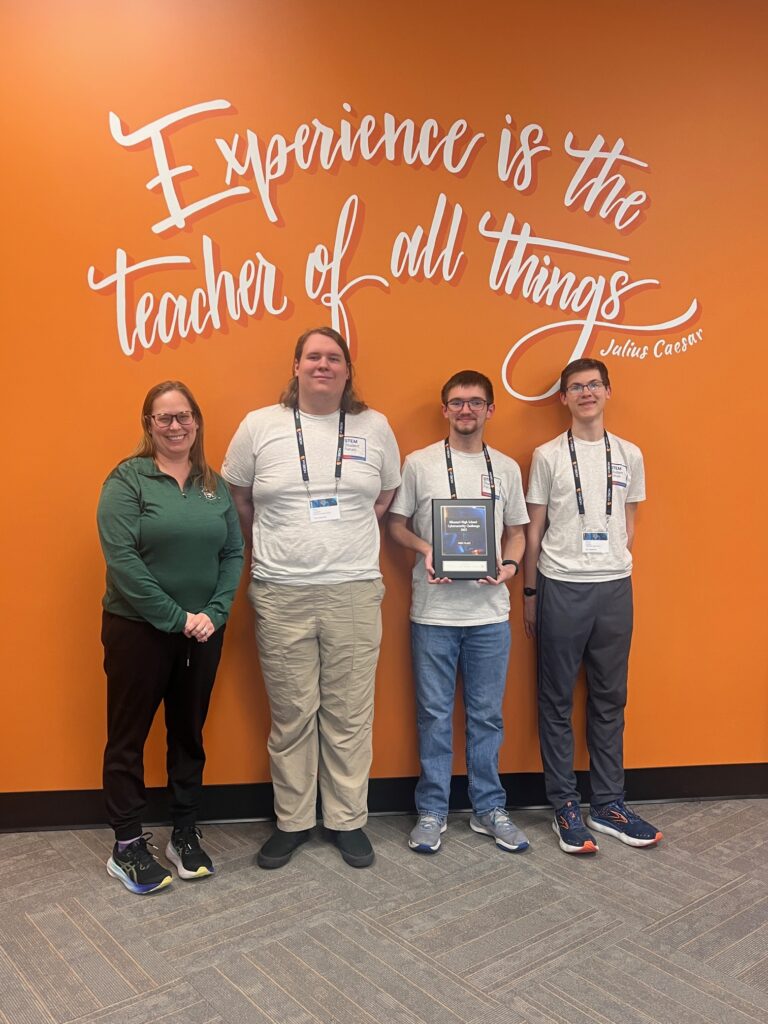First place: Pattonville High School Capstoners, Elisha Dukes, Matthew Wasser and Rhys Harden, with Stephanie Carson, teacher