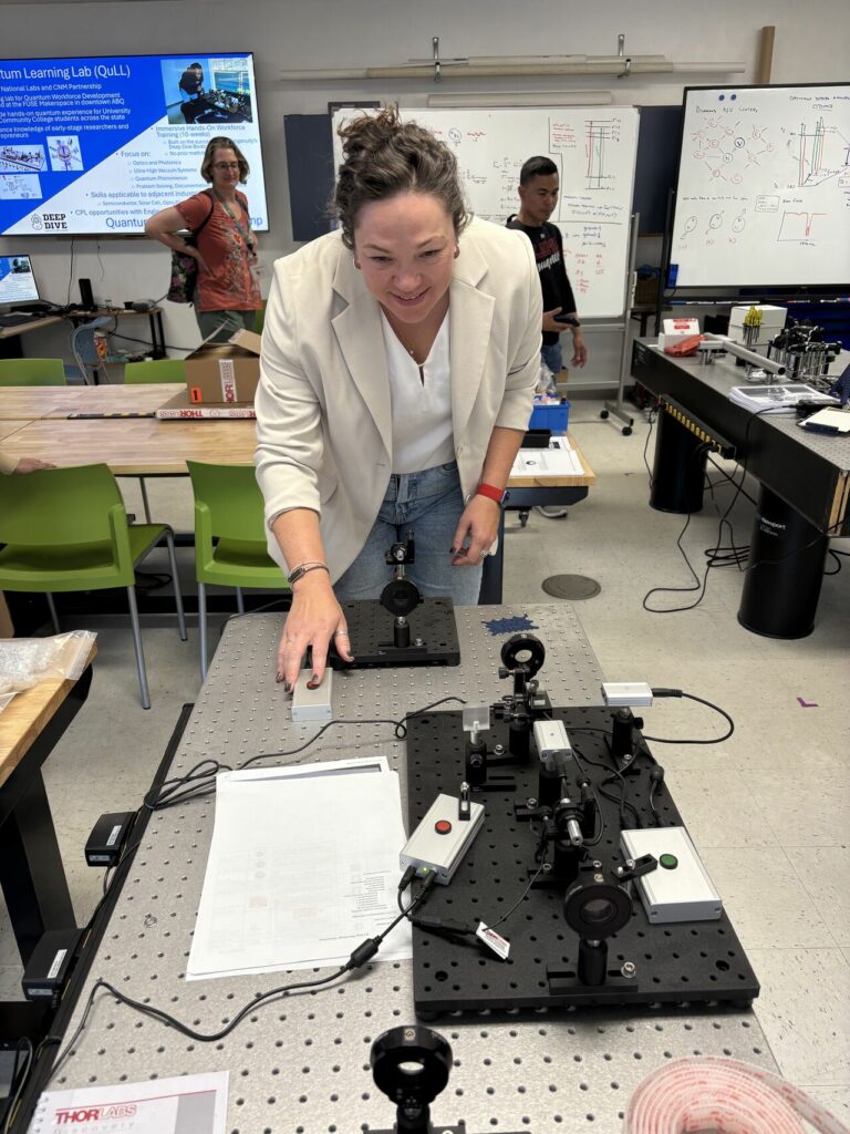 Megan clicking a quantum lab simulation. 