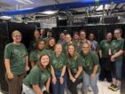Group photo of QCaMP participants in front of Missouri's Hellbender.